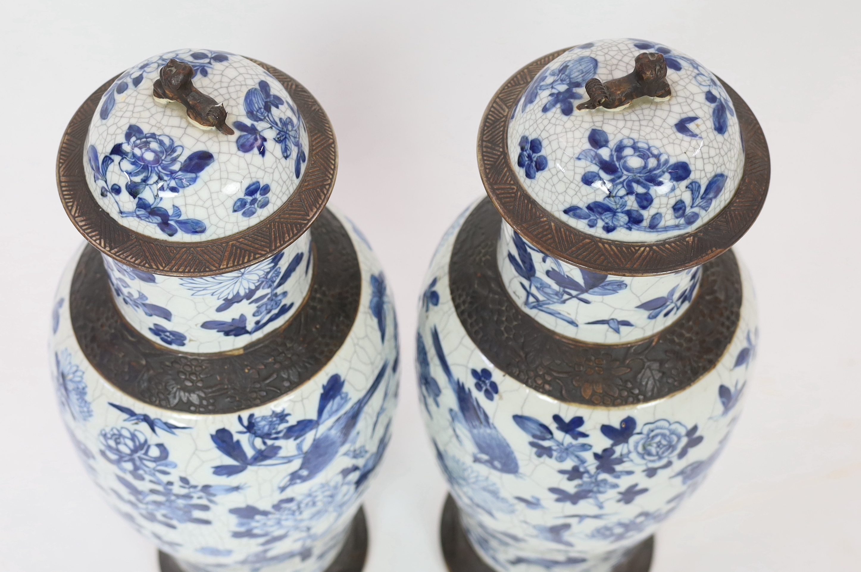 A pair of large Chinese blue and white crackle glaze vases and covers, late 19th century